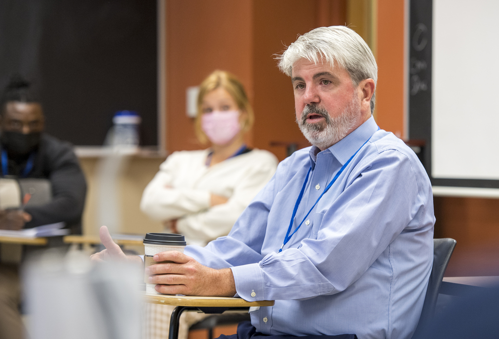 man speaking in classroom